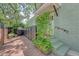 Charming side entrance with climbing vine and black railings at 735 Woodward Rd, Charleston, SC 29407
