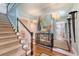 Light and airy entryway with staircase, hardwood floors, and elegant decor creating a warm ambiance at 735 Woodward Rd, Charleston, SC 29407