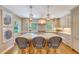 Spacious kitchen with marble island, pendant lighting, stainless appliances, and bar stool seating at 735 Woodward Rd, Charleston, SC 29407