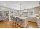 Spacious kitchen with marble island, pendant lighting, stainless appliances, and bar stool seating at 735 Woodward Rd, Charleston, SC 29407