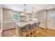 Bright kitchen with a large island, stainless steel appliances, and stylish pendant lighting at 735 Woodward Rd, Charleston, SC 29407