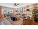 Cozy living room with a ceiling fan, plush seating, and natural light from windows provides comfort at 735 Woodward Rd, Charleston, SC 29407