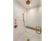 Modern shower with tile surround, bronze fixtures, and a built-in bench at 735 Woodward Rd, Charleston, SC 29407