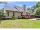 Spacious backyard featuring a deck, patio with fire pit, and privacy fence at 8166 Scottswood Dr, North Charleston, SC 29418