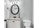 Charming bathroom featuring a modern vanity with granite countertops and an oval mirror at 8166 Scottswood Dr, North Charleston, SC 29418