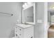 Bathroom featuring a white vanity with a mirror, neutral walls, and access to the hallway at 8166 Scottswood Dr, North Charleston, SC 29418