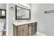 Bathroom showcasing a double vanity with stylish lighting and a decorative mirror, next to toilet at 8166 Scottswood Dr, North Charleston, SC 29418