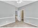 Bedroom featuring neutral walls and carpet with access to a closet and hallway at 8166 Scottswood Dr, North Charleston, SC 29418