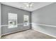 Bedroom featuring neutral walls and carpet with natural light streaming in through dual windows at 8166 Scottswood Dr, North Charleston, SC 29418