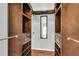 Walk-in closet with custom shelving, drawers, and ample storage space for an organized wardrobe at 8166 Scottswood Dr, North Charleston, SC 29418