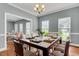 Elegant dining room with a modern table set, ample seating, and natural light creating an inviting atmosphere at 8166 Scottswood Dr, North Charleston, SC 29418
