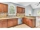 Charming kitchen with updated stainless steel appliances, mosaic tile backsplash, and granite countertops at 8166 Scottswood Dr, North Charleston, SC 29418