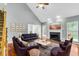 Spacious living room with vaulted ceiling, fireplace, hardwood floors, and picture windows at 8166 Scottswood Dr, North Charleston, SC 29418