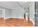 Bright living room with hardwood floors, crown molding, and an open floor plan showcasing a welcoming and airy space at 8166 Scottswood Dr, North Charleston, SC 29418