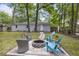 Brick patio with a firepit and furniture, surrounded by lush trees at 825 Savage Rd, Charleston, SC 29414