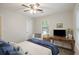 This comfortable bedroom includes a desk, TV, and multiple windows for natural light at 825 Savage Rd, Charleston, SC 29414