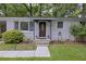 Charming home featuring a brick exterior, landscaped front yard, and inviting front door at 825 Savage Rd, Charleston, SC 29414
