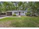 Charming single-story home with a well-maintained lawn and mature trees in a desirable neighborhood at 825 Savage Rd, Charleston, SC 29414