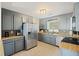 Updated kitchen featuring modern stainless steel appliances, gray cabinets and tile backsplash at 825 Savage Rd, Charleston, SC 29414