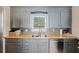Well-lit kitchen showcasing butcher block countertops, modern fixtures, and a stainless steel dishwasher at 825 Savage Rd, Charleston, SC 29414