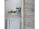 Convenient laundry area features modern appliances and ample storage space on the shelving at 825 Savage Rd, Charleston, SC 29414