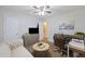 This comfortable living room includes a sofa, desk, television, and a ceiling fan at 825 Savage Rd, Charleston, SC 29414
