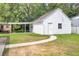Detached garage with carport and pathway with lawn at 8612 Delhi Rd, North Charleston, SC 29406