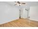 Bright bedroom with wood floors, stylish shiplap accent wall, and a ceiling fan at 8612 Delhi Rd, North Charleston, SC 29406