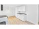 Bright kitchen featuring white cabinets, granite counters, and stainless appliances at 8612 Delhi Rd, North Charleston, SC 29406