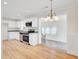 Modern kitchen featuring white cabinets, stainless steel appliances, and granite countertops at 8612 Delhi Rd, North Charleston, SC 29406