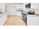 Modern kitchen featuring white cabinets, stainless steel appliances, and granite countertops at 8612 Delhi Rd, North Charleston, SC 29406