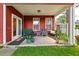 Inviting covered back porch with comfortable seating and a relaxing outdoor space at 8965 N Red Maple Cir, Summerville, SC 29485