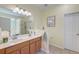 Bright bathroom with double vanity, tile floors, shower, tub, white trim, and a separate toilet room at 8965 N Red Maple Cir, Summerville, SC 29485