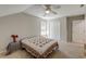 Carpeted bedroom featuring neutral walls, natural light, and a ceiling fan, offering a calm atmosphere at 8965 N Red Maple Cir, Summerville, SC 29485