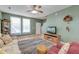 Inviting living room featuring hardwood floors, a comfortable sofa, and large windows at 8965 N Red Maple Cir, Summerville, SC 29485