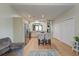Open floor plan with kitchen, dining, and living area featuring stainless appliances and wood floors at 8965 N Red Maple Cir, Summerville, SC 29485