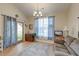 Comfortable living space with a vaulted ceiling, light-filled windows and exterior access at 8965 N Red Maple Cir, Summerville, SC 29485