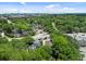 Aerial view of residential area, with lush greenery, a highway and a skyline in the distance at 9 Wesley Dr, Charleston, SC 29407