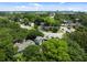Aerial view of residential area with lush green trees, showing houses and streets below at 9 Wesley Dr, Charleston, SC 29407