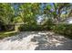 Large, gravel-covered area provides lots of parking or a place for outdoor activities at 9 Wesley Dr, Charleston, SC 29407