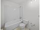 This bathroom offers a tub and shower, standard toilet and white tile at 9 Wesley Dr, Charleston, SC 29407