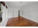 Bright bedroom featuring hardwood floors and white walls with ample closet space at 9 Wesley Dr, Charleston, SC 29407