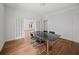 Spacious dining area featuring hardwood floors and a contemporary glass-top table perfect for entertaining at 9 Wesley Dr, Charleston, SC 29407