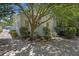 Charming home with lush landscaping offers privacy and curb appeal at 9 Wesley Dr, Charleston, SC 29407