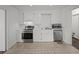 Well-maintained kitchen features white cabinetry, stainless steel appliances, and functional layout at 9 Wesley Dr, Charleston, SC 29407