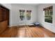 Sun-filled room with hardwood floors and built-in shelving creates a cozy atmosphere at 9 Wesley Dr, Charleston, SC 29407