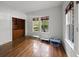 Sun-filled room with hardwood floors and built-in shelving creates a cozy atmosphere at 9 Wesley Dr, Charleston, SC 29407