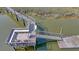 Aerial shot of a dock with seating, stairs to the water and a place for sunbathing and relaxing by the water at 932 N Shem Dr, Mount Pleasant, SC 29464