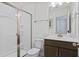 Modern bathroom featuring a glass shower enclosure with brushed nickel fixtures, toilet and vanity with white countertops at 101 Caleb Ct, Ladson, SC 29456