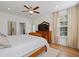 Bright main bedroom features a ceiling fan, wood floors, and a decorative wood dresser and mirror at 101 Caleb Ct, Ladson, SC 29456